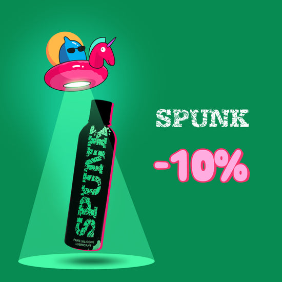 Promotional banner on a green background offering a 10% discount on Spunk, featuring a whimsical UFO beaming down a black bottle of Spunk Pure Silicone Lubricant next to distressed white product branding text.