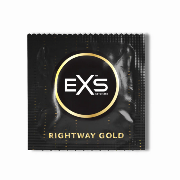 Close-up of a single black and gold foil wrapper for an EXS Rightway Gold condom.