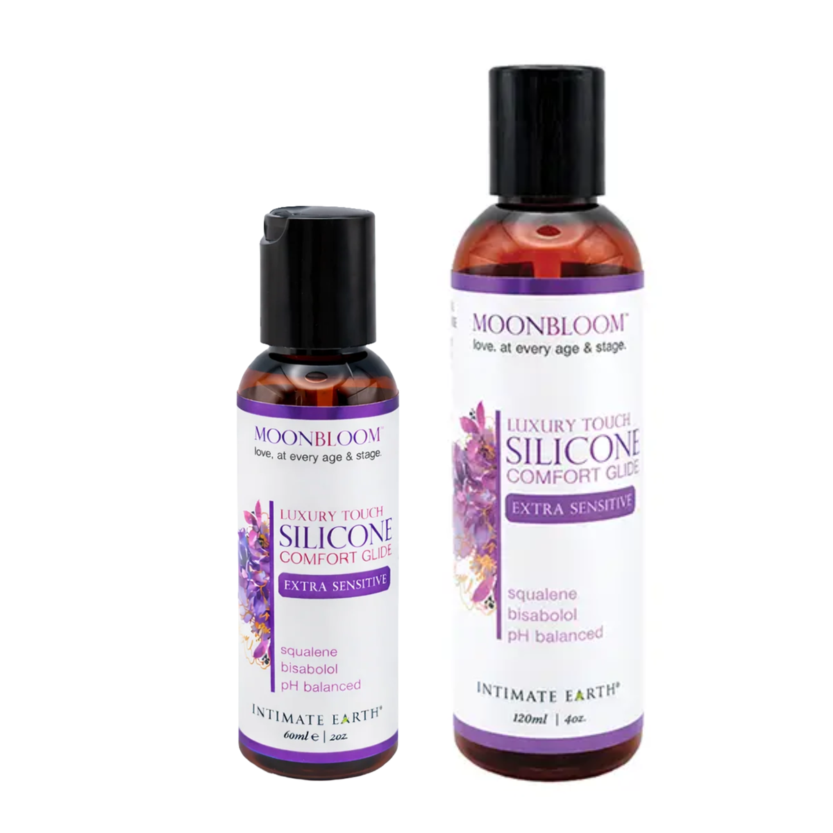 Size comparison view showing two amber bottles of Intimate Earth Moon Bloom silicone comfort glide standing side by side in 60 ml (2 fl oz) and 120 ml (4 fl oz) capacities. Main image