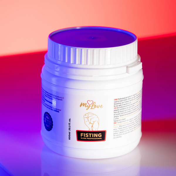 High-angle front view of the 600 ml MyLove Fisting Slide Professional gel tub illuminated under dynamic blue and pink studio lighting.