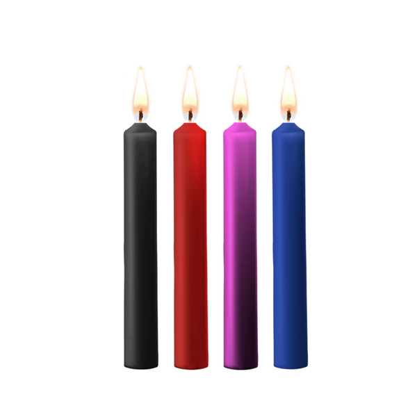 Four lit Ouch! Teasing Wax Candles Paraffin 4-Pack in black, red, purple, and blue.