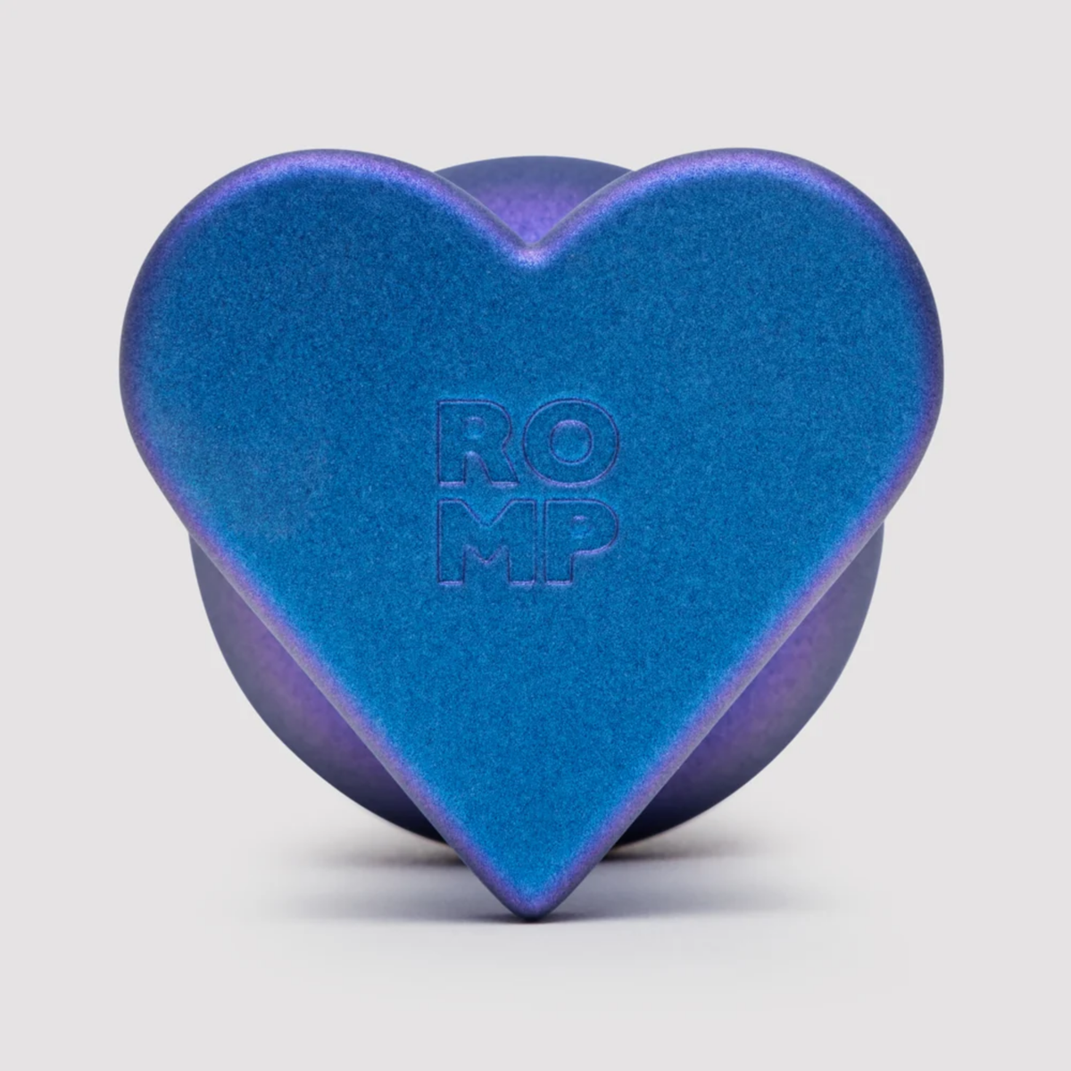 Macro view of the blue-purple metallic base showing the heart-shaped flared safety base embossed with the "ROMP" logo.
