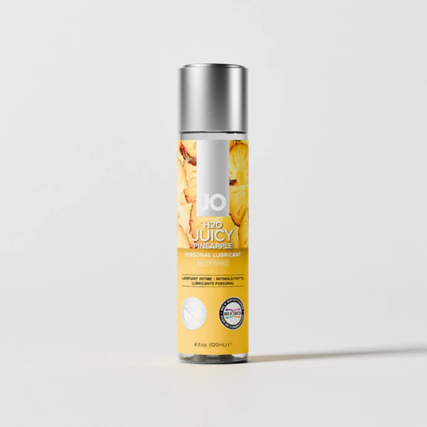 Front view of the 4 fl. oz. (120ml) bottle of System JO H2O Juicy Pineapple personal lubricant. The clear cylinder bottle is fitted with a solid silver cap over a bright yellow label.