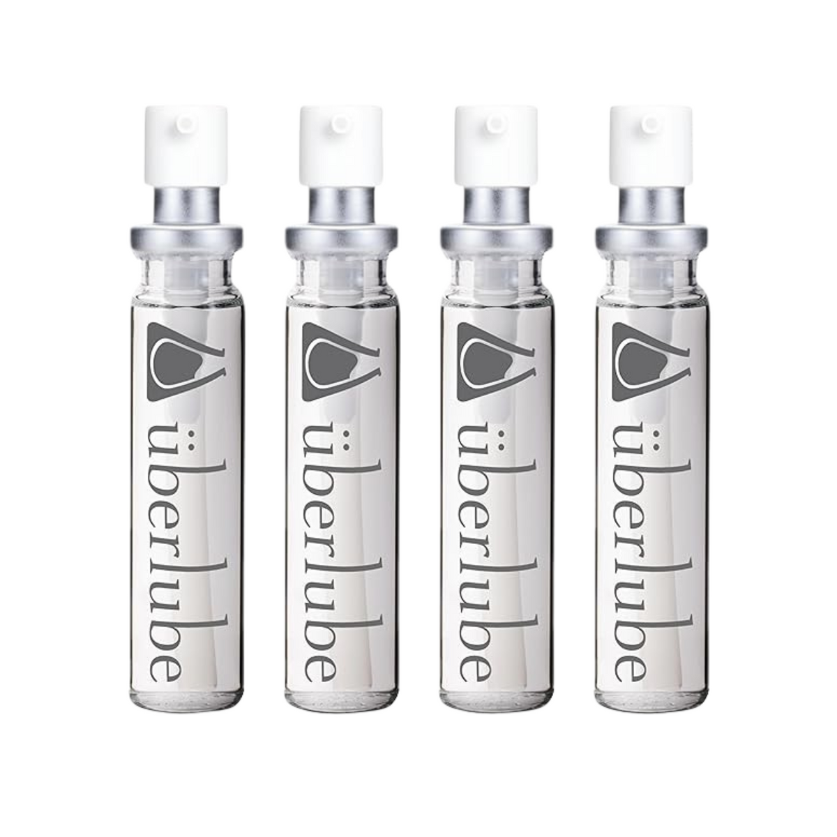 Four transparent glass spray bottles of Überlube lubricant, each with "überlube" and a stylized eye logo printed vertically, stand in a row. These travel-friendly WorldCondoms offerings provide discreet, on-the-go intimacy. Main image