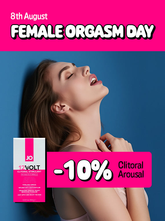 Promotional banner for Female Orgasm Day on August 8th featuring a woman leaning back with her eyes closed in ecstasy against a blue backdrop, alongside System JO 12 Volt Clitoral Stimulant and a bright pink badge offering 10% off Clitoral Arousal products.